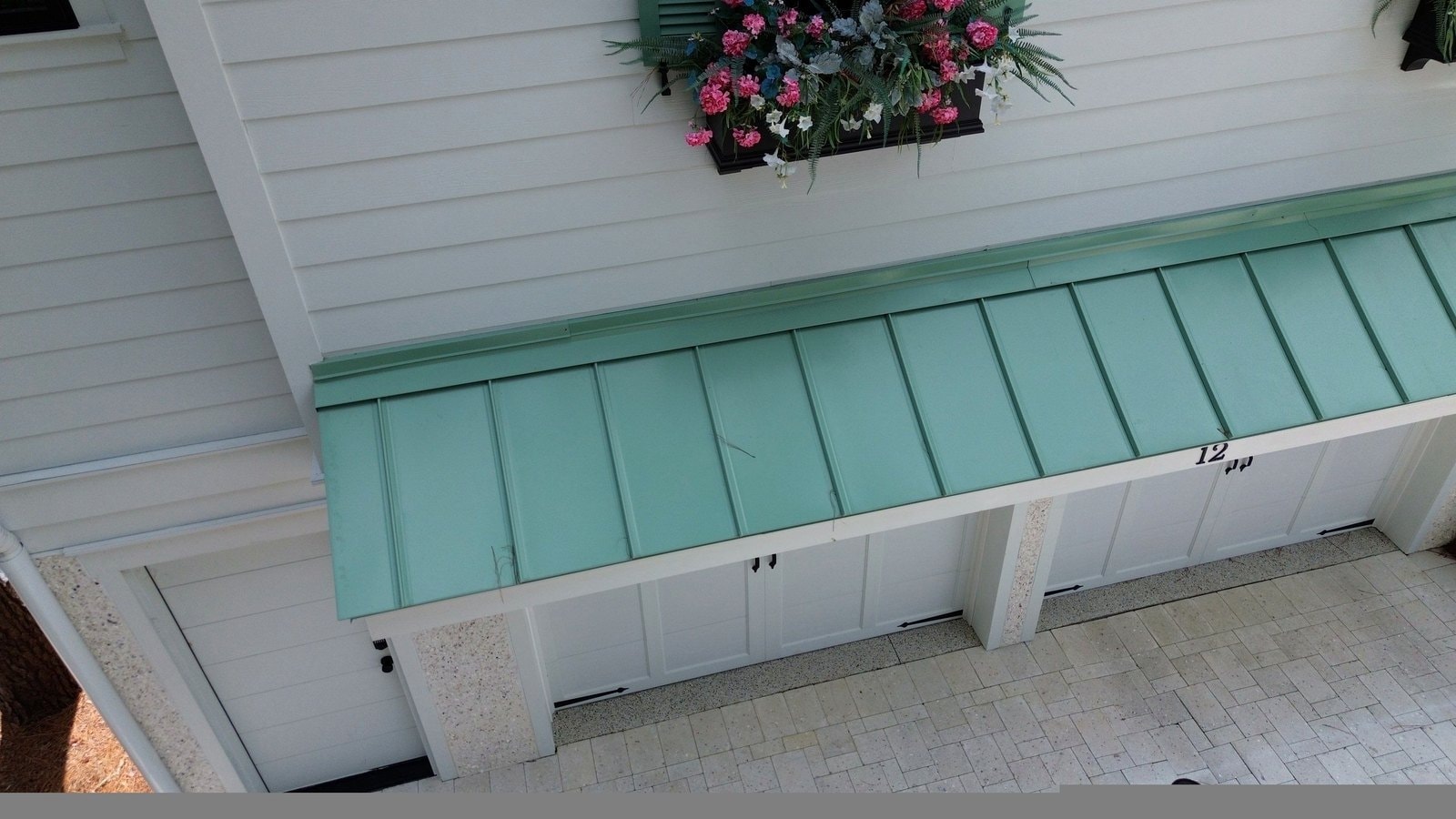 Custom teal standing seam metal awning on building in Hilton Head Island SC